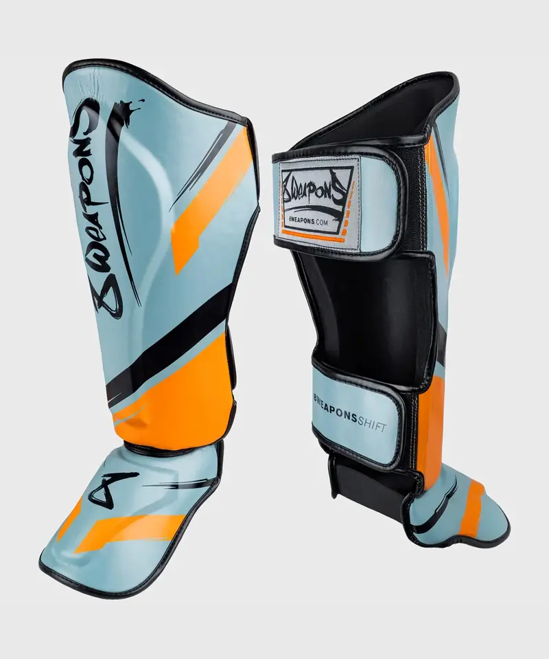 Protège-Tibias 8 Weapons Shift - Bleu/Noir/Orange